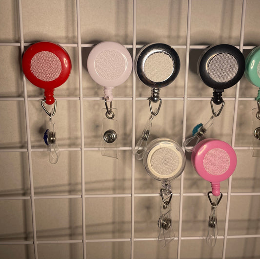 Interchangeable badge with attachment purchase